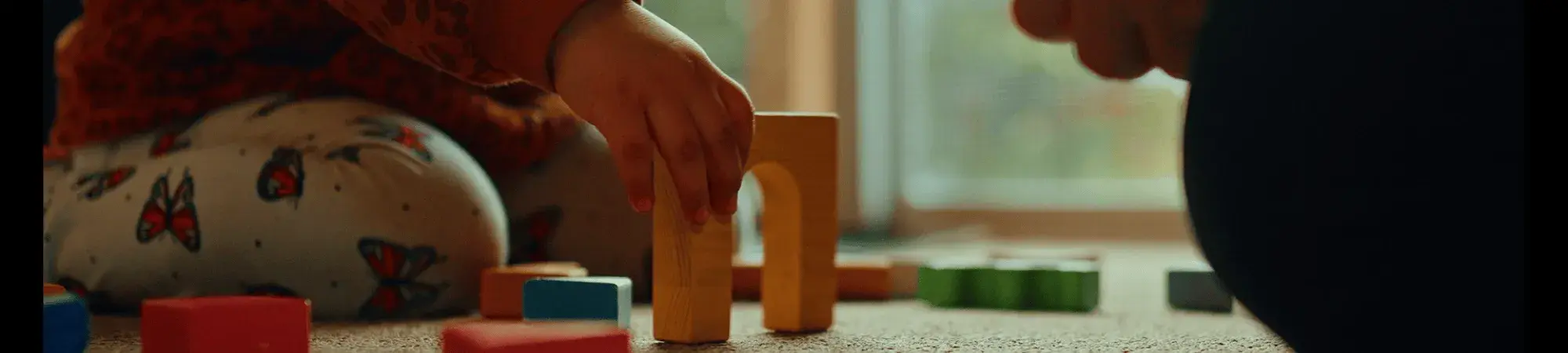 young child with building blocks