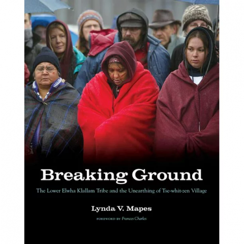 Cover of book with people in warm clothing with heads bowed