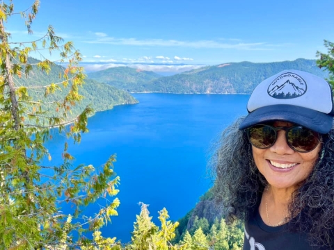 Smiling woman with lake in background