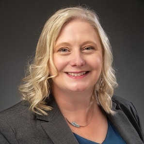 Smiling woman in suit jacket