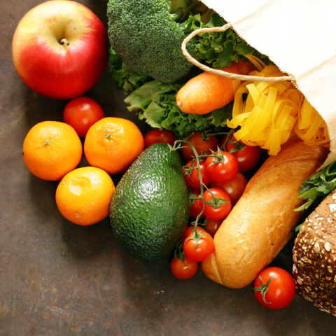 bag full of fresh produce laying on a table