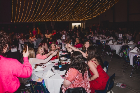 women cheersing at a table