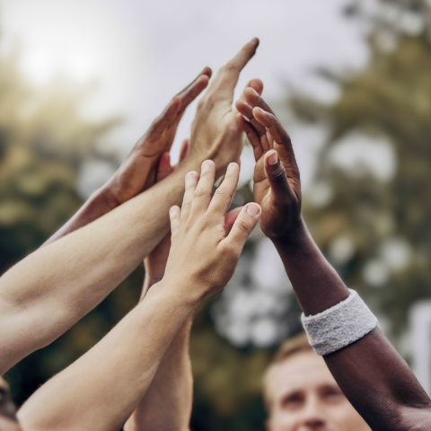 Group of people giving high 5s