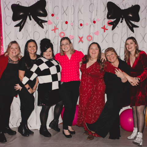 Group of women in cocktail outfits