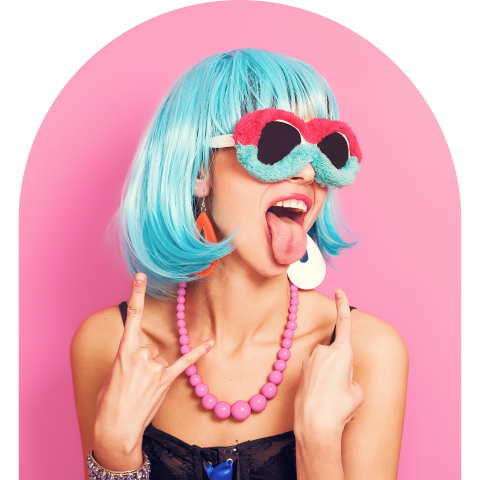 Woman in a blue wig and fuzzy sunglasses sticking out her tongue